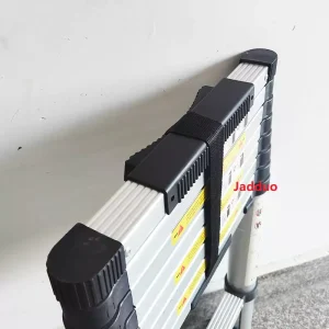 Close-up real photo of the one-key lock mechanism on Jadduo telescopic ladder, showing sturdy construction