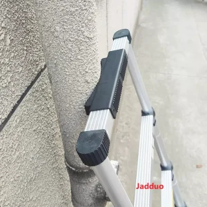 Close-up real photo of the one-key lock mechanism on Jadduo telescopic ladder, showing sturdy construction